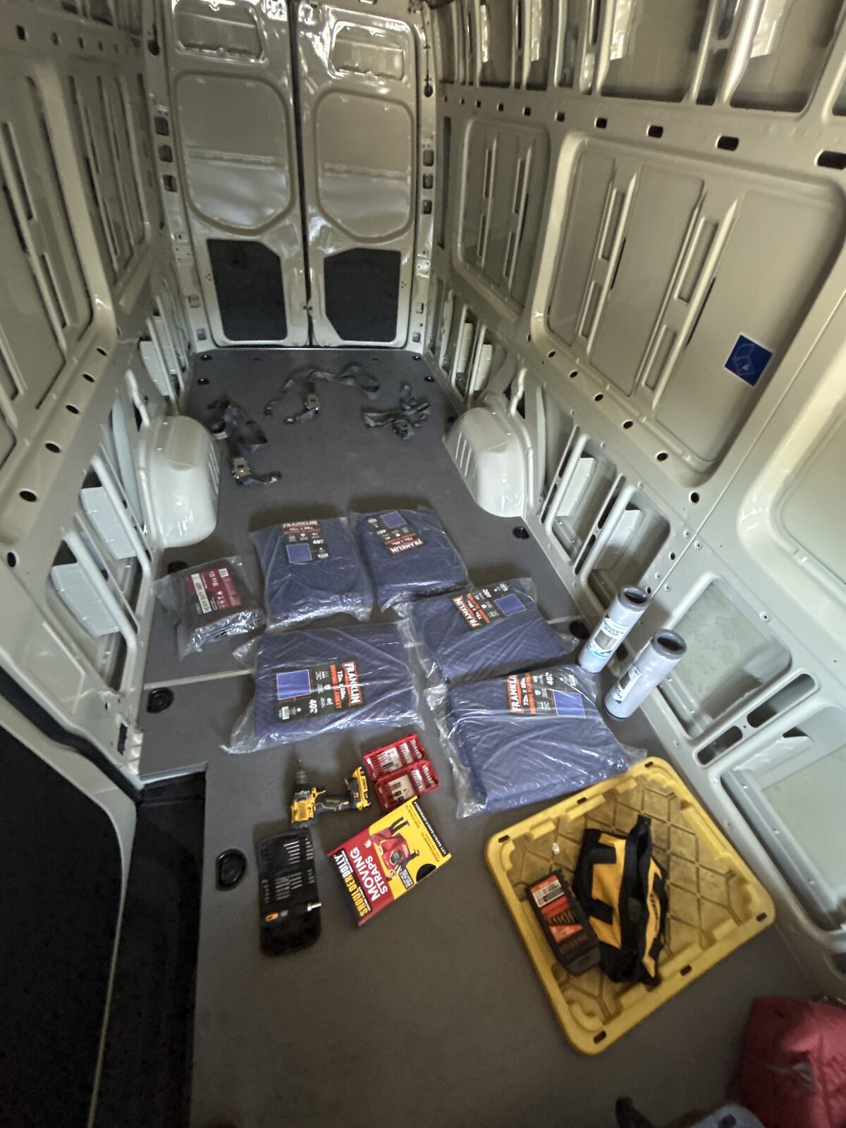 Van loaded out with moving blankets and tools for a job
