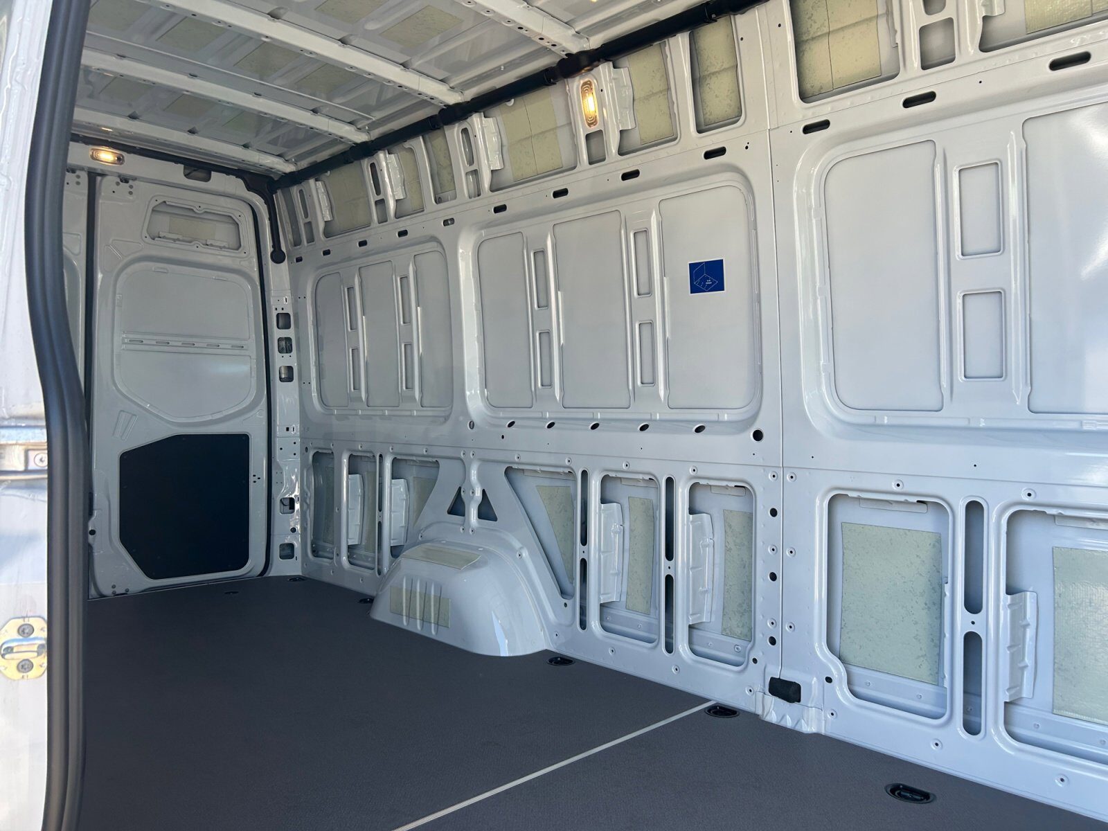 Spacious empty cargo area inside the Sprinter van